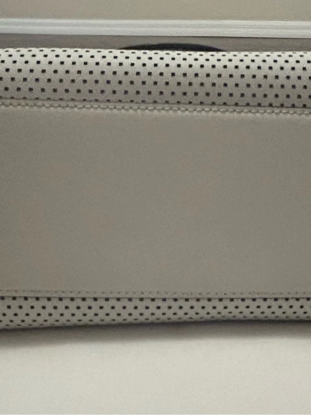 Michael Kors White Perforated Satchel with Black Trim and matching black wallet.